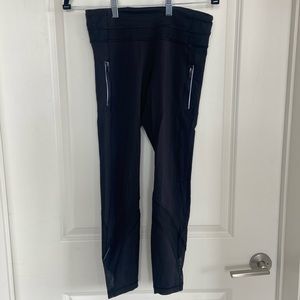 Cropped Lululemon black leggings with mesh detail